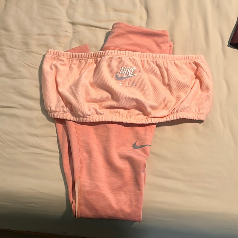Soft pink Nike workout outfit.